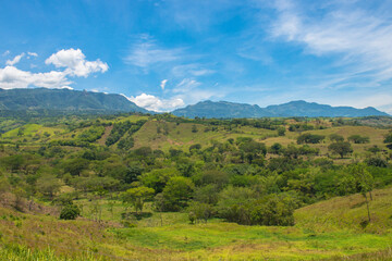 Fototapeta na wymiar Panoramic landscape with mountains and blue sky. Tamesis, Antioquia, Colombia.