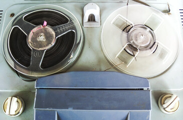Old vintage player of reels. The antique Reel-to-Reel. Tape Recorder with spools. Bobbin tape recorder