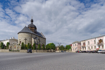 Street view with Holy Trinity church in Kamianets-Podilskyi old town, Ukraine