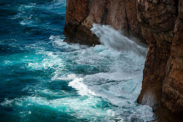 waves crashing on rocks