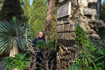Woman enjoying the plants in the Garden