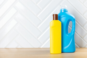 Cleaning product plastic container for house clean on wooden table . household chemicals