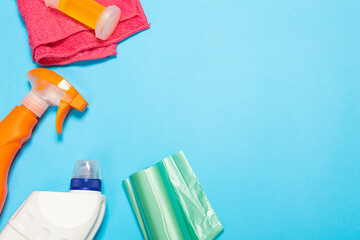 spray and sponges for cleaning and washing on a blue isolated background. Cleaning concept. Banner.
