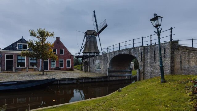 Day Time Lapse with clouds and windmill in Sloten, Friesland, The Netherlands