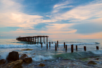 Obraz premium Beautiful dramatic sunset over the old bridge by the sea in Balchik, Bulgaria, Eastern Europe - dawn, dusk