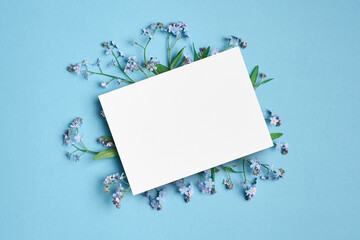 Invitation or greeting card mockup with blue flowers