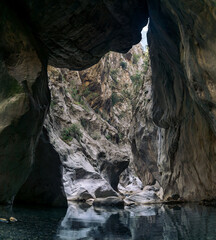 huge stone hangs stuck between two walls of the Goynuk canyon in Turkey
