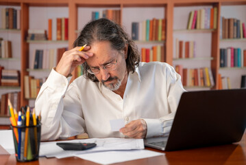 Frustrated mature man feels angry unable to do tax preparation successfully get debt deficit find mistake calculations. Annoyed male count business costs think on bankruptcy risks too high taxes