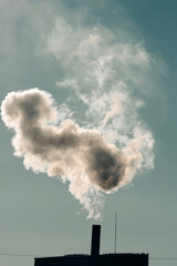 Smoke coming out of factory chimney.