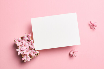 Invitation or blank greeting card mockup with hyacinth flowers on pink background
