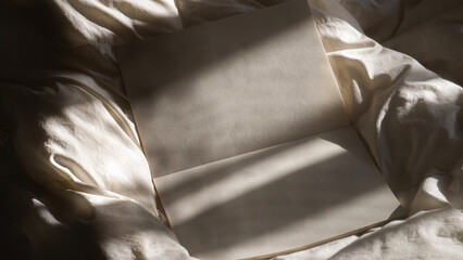 Blank book on the bed with natural light