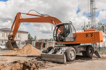 Excavator digging heavy earth work on an industrial machine on a construction site industry