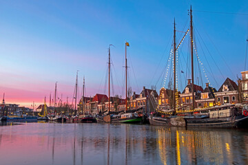 Fototapeta na wymiar Harbor from Harlingen in Friesland the Netherlands at sunset