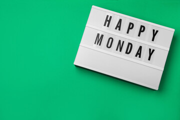 Light box with message Happy Monday on green background, top view. Space for text