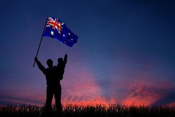 Father and son hold the flag of Australia