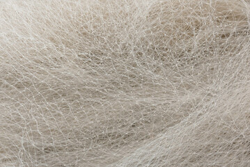 Close up view of a white fishing net at harbor.