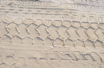 Light sand tire tracks horizontal photo road . - 488812755