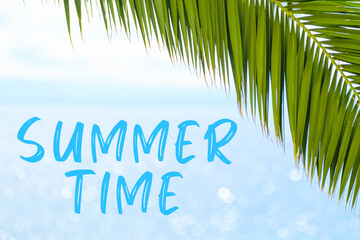 Fototapeta na wymiar Summer time message written in elegant font on the background with palm leaf and blue sea. Holiday concept and advertising of tour agency. 