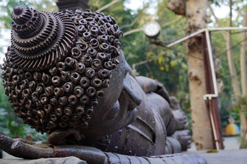 Close up Sleeping buddha image made using iron