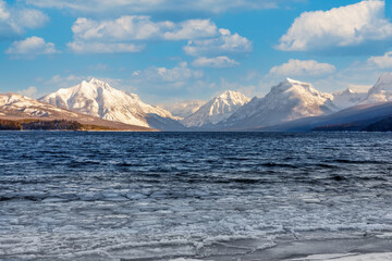 winter scene of Lake McDonald, Glacier National Park, Montana with floating ice in foreground