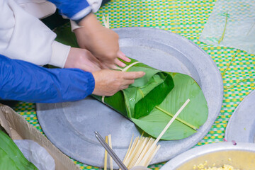 Making chung cake - A traditional food in Tet holiday- Vietnam including green beans, glutinous...