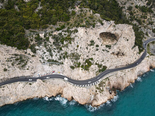 Aerial view of Grotta dei Falsari, Robber's Cave in Liguria, near Varigotti, Noli and Capo Noli. Drone photography of this cave in the rock with Aurelia street of Ligury, province of Savona.