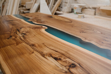 Furniture manufacturing. A fragment of a wooden, varnished part in a drying room for painted...