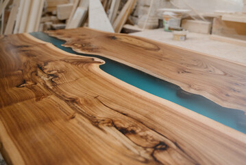 Furniture manufacturing. A fragment of a wooden, varnished part in a drying room for painted products.