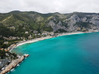 Aerial view of Aurelia street in Noli, Capo Noli and Varigotti, province of Savona. Drone photography from above of snake street snake in Liguria, north Italy, near Punta Crena and Spotorno.