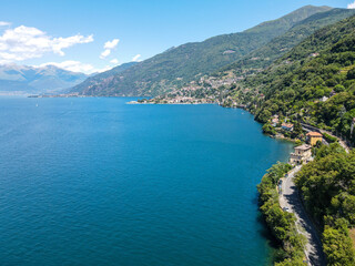 Naklejka na ściany i meble Aerial view of Bellano, panoramic view from the drone to the famous old Italy town of Como lake. Near Varenna and Lierna, Bellano is a small town in Como, near Lecco, in Lombardia.