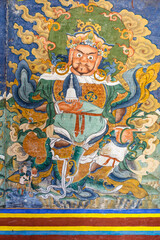 Colorful mural of a Buddhist Guru Rinpoche inside of a monastery in Mongar, Bhutan, Asia