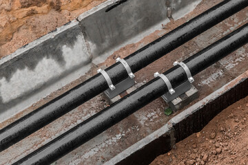 Repair of the water line of the heating main pipe in the ground trench pipeline at the construction site work industry