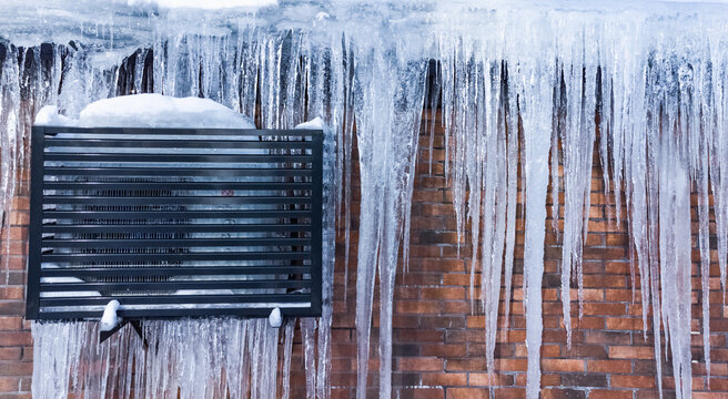 icicles on the roof with air conditioning
