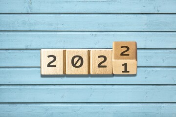 Wooden cube block for 2022 on background , preparation for merry Christmas and happy new year
