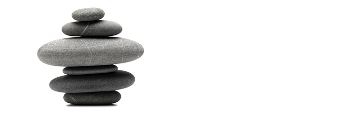 Pyramid of the balanced grey stones isolated on white background with copy space. Banner.