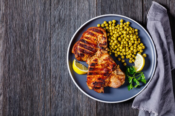 grilled pork t-bone steaks with boiled green peas