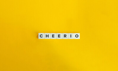 Cheerio Word on Letter Tiles on Yellow Background. Minimal Aesthetics.