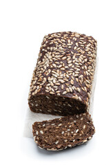 Homemade dark rye bread with sunflower seeds isolated on white