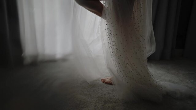 Girl in transparent white dress. Close up slim and sexy girl legs.