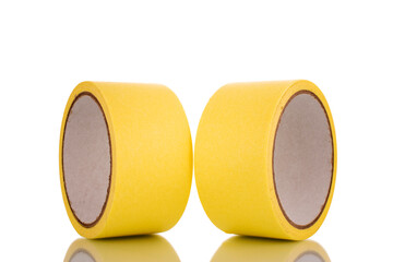 Two painter's tape, yellow, macro, isolated on a white background.