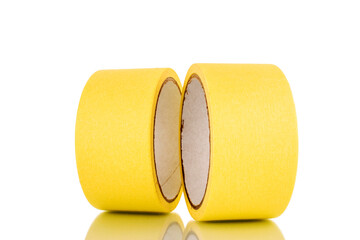 Two painter's tape, yellow, macro, isolated on a white background.