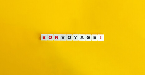 Bon Voyage Expression on Letter Tiles on Yellow Background. Minimal Aesthetics.
