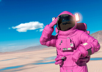 astronaut is thinking about in the desert of another planet after rain © DM7