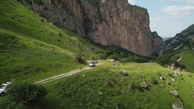 cars drive along a winding mountain road. Beautiful mountain landscape Elbrus