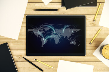 Top view of modern digital tablet monitor with abstract world map with connections, research and strategy concept. 3D Rendering