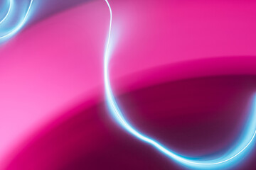 Neon abstract led lines on a magenta background. Fluorescent cyberpunk backdrop.