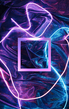 Neon led lights with square frame on a colorful fabric background.  Futuristic abstract backdrop. Stock Photo | Adobe Stock