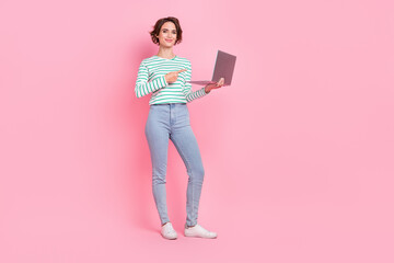 Full length photo of sweet millennial bob hairdo lady index laptop wear shirt jeans shoes isolated on pink background