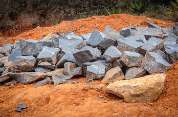 Rocks blasted and broken down for construction work in hilly area. Construction work in mountain area.