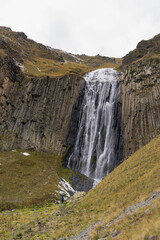 Mountain waterfall in the forest. Waterfall view. Waterfall in mountains. Waterfall pool